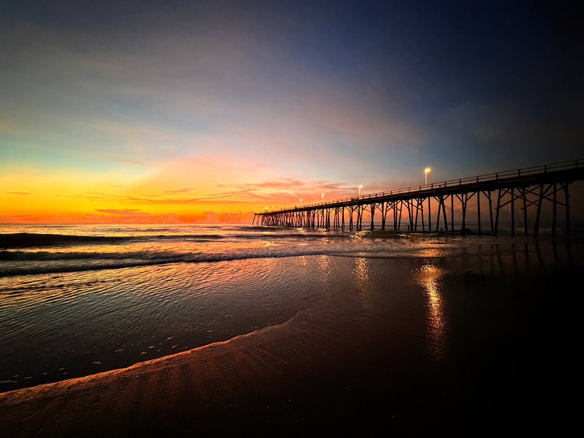Shimmering Pier coastal sunrise photograph